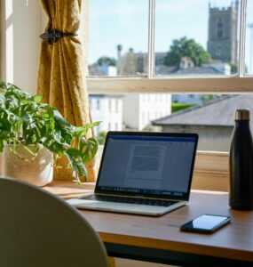 Home office with laptop and plants