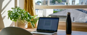 Home office with laptop and plants